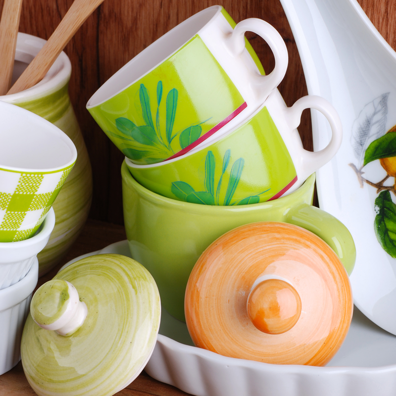 Photo of a cupboard full of dishes waiting to be culled and decluttered