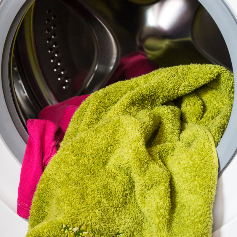 Photos of a full washing machine and laundry for water wise living workshops in and around Sydney